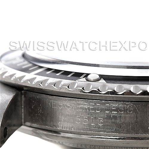 The image shows a close-up of the side and bezel of a Rolex Vintage Collection 5513 Men
s Stainless Steel Black Dial 5513 Men
s Stainless Steel Black Dial model, focusing on the engraved serial number.