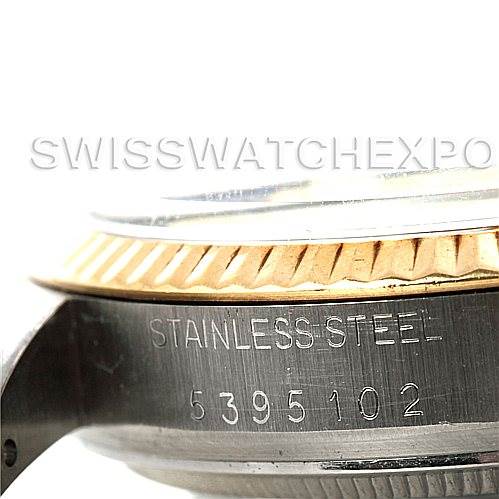 This is a close-up side view of a Rolex Vintage Collection 16013 Men's Stainless Steel White Dial 16013 Men's Stainless Steel White Dial watch, showing part of the bezel and the serial number on the stainless steel case.