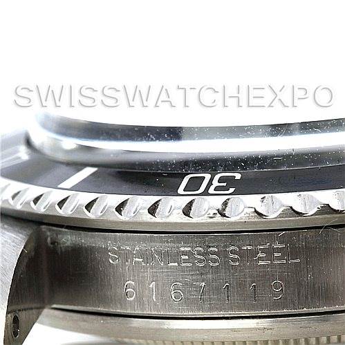 The image shows a close-up side view of the bezel and case of a Rolex Vintage Collection 1680 Men's Stainless Steel  1680 Men's Stainless Steel  watch, with 'Stainless Steel' and a serial number inscribed.