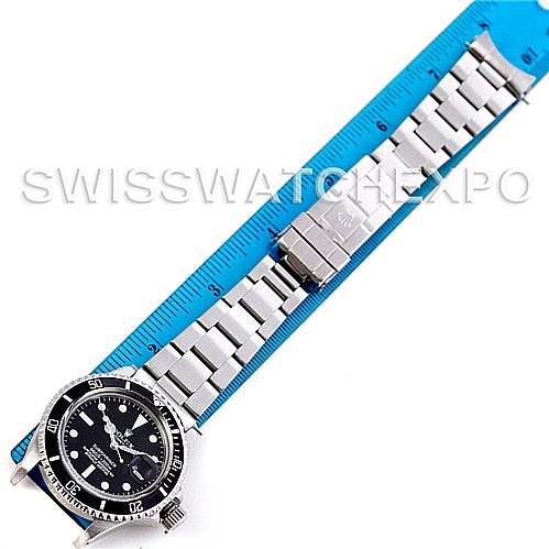 The image shows a Rolex Vintage Collection 1680 Men's Stainless Steel  1680 Men's Stainless Steel  watch laid flat with its face and metal bracelet visible, aligned next to a blue ruler for scale.