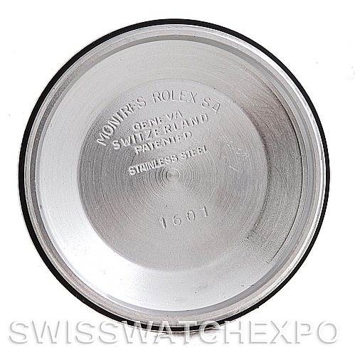 This image shows the interior of the case back for a Rolex Vintage Collection 1601 Men's Steel and Gold (two tone) Silver Dial 1601 Men's Steel and Gold (two tone) Silver Dial watch model 1601, displaying inscriptions and markings.
