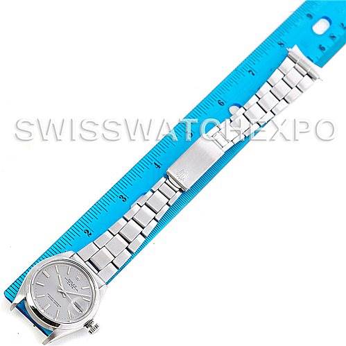 The image shows a top view of a Vintage Collection Rolex watch, including the face and fully extended metal bracelet placed next to a ruler.