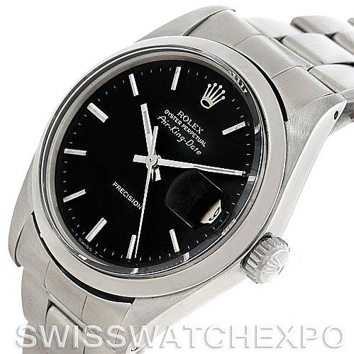 This image shows a close-up of the dial, bezel, crown, and part of the bracelet of a Rolex Vintage Collection 5700 Men
s Stainless Steel Black Dial 5700 Men
s Stainless Steel Black Dial watch.