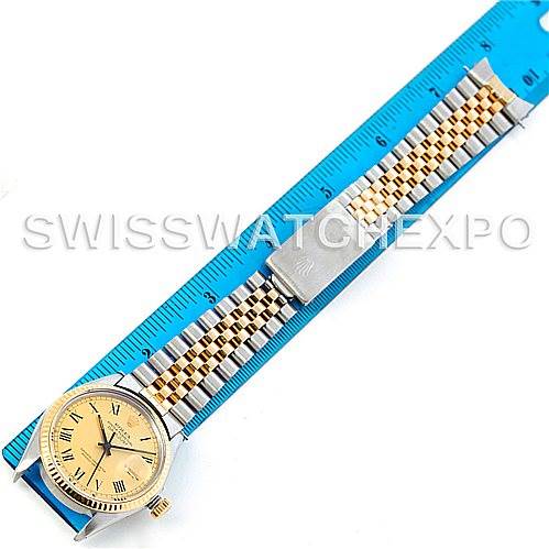 The image shows a top view of a Rolex Vintage Collection 16013 Men's Stainless Steel Champagne Dial 16013 Men's Stainless Steel Champagne Dial watch with a ruler, displaying the watch face and bracelet.