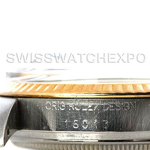 This image shows a side view of the Rolex Vintage Collection 16013 Men's Stainless Steel Champagne Dial 16013 Men's Stainless Steel Champagne Dial watch with the model number 6913 and part of its case and bezel visible.