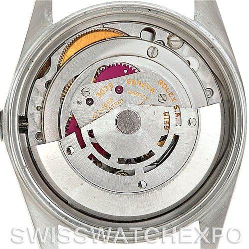 The image shows the back view of a Rolex Vintage Collection 16013 Men's Stainless Steel Champagne Dial 16013 Men's Stainless Steel Champagne Dial watch, highlighting its exposed mechanical movement.