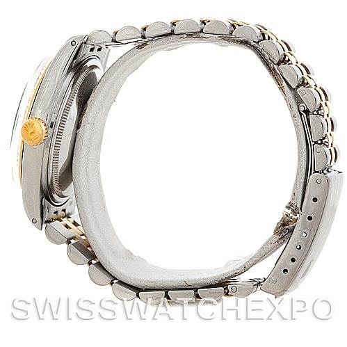 This image shows the side view of a Rolex Vintage Collection 16013 Men's Stainless Steel Champagne Dial 16013 Men's Stainless Steel Champagne Dial watch, highlighting its band, case, and crown.