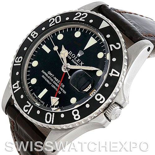 This image shows a Vintage Collection Rolex GMT-Master watch at an angle showcasing the face, bezel, case, crown, and strap.