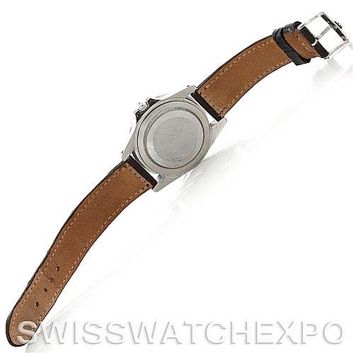 The image shows the backside of a Vintage Collection Rolex watch, displaying the case back and leather strap.
