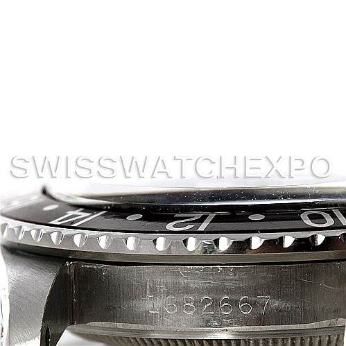 This image shows a side angle of the Rolex Vintage Collection 1675 Men's Stainless Steel Black Dial 1675 Men's Stainless Steel Black Dial watch, focusing on the bezel, mid-case, and partial serial number.