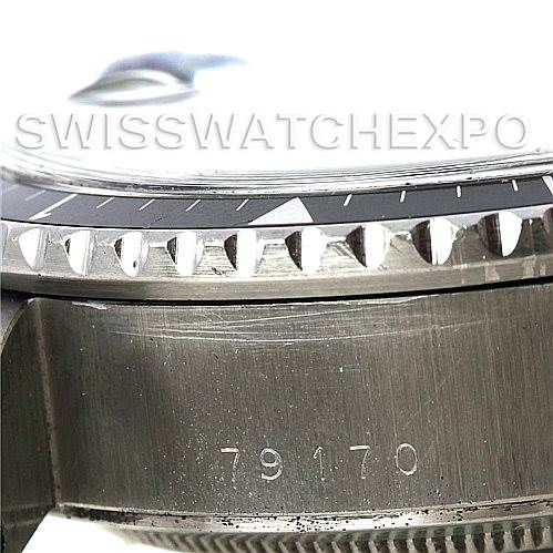 Close-up of a Rolex Vintage Collection 79170 Men
s Stainless Steel Silver Dial 79170 Men
s Stainless Steel Silver Dial watch showing the bezel, crystal edge, and part of the case with the model number 79170.