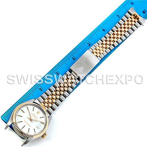 The image shows a top-view angle of a Rolex Vintage Collection 16013 Men's Stainless Steel White Dial 16013 Men's Stainless Steel White Dial watch, highlighting its face, bezel, and bracelet alongside a measuring ruler.