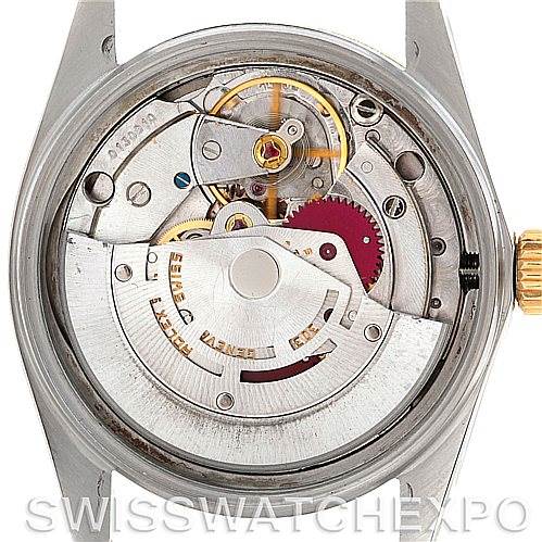 The image shows the back view of the Rolex Vintage Collection 16013 Men's Stainless Steel White Dial 16013 Men's Stainless Steel White Dial model, revealing its intricate movement and internal mechanisms.