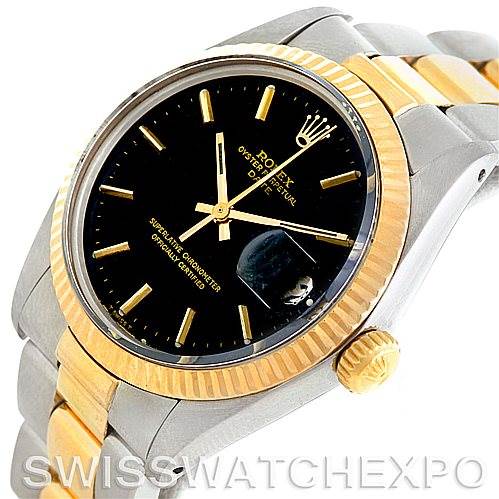 This image shows a close-up of the Rolex Vintage Collection 1500 Men's Steel and Gold (two tone) Black Dial 1500 Men's Steel and Gold (two tone) Black Dial watch featuring a gold and silver bezel and black dial.