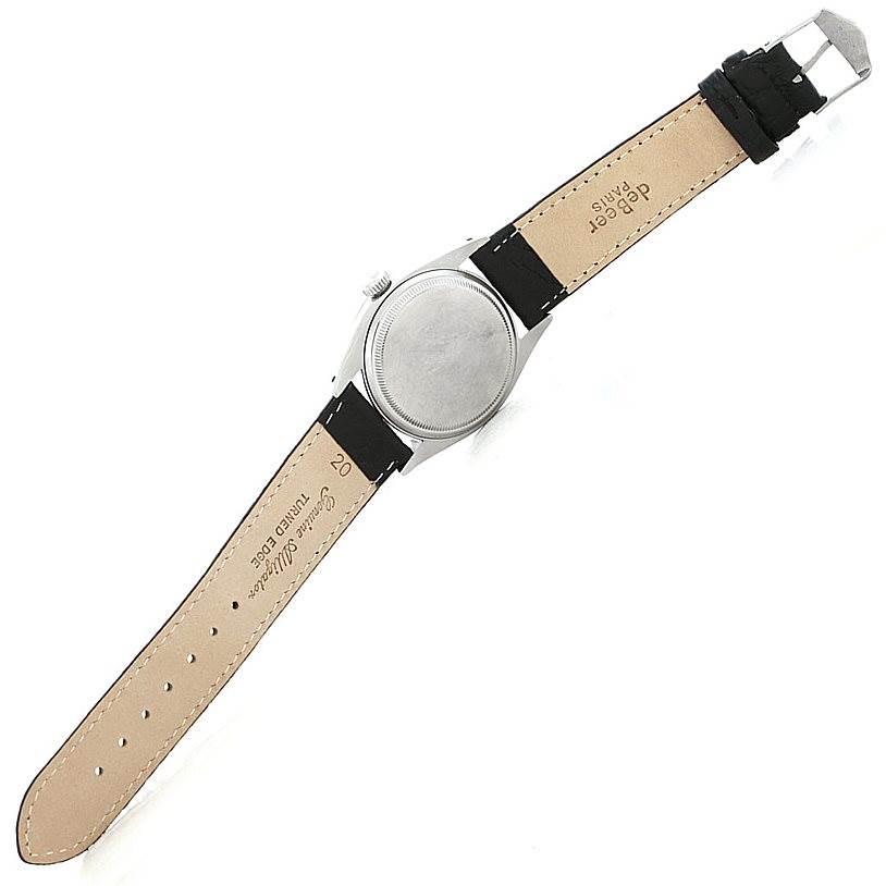 The watch shown is a Rolex Vintage Collection 6610 Men's Stainless Steel Black Dial 6610 Men's Stainless Steel Black Dial model viewed from the back, highlighting the case back and leather strap.