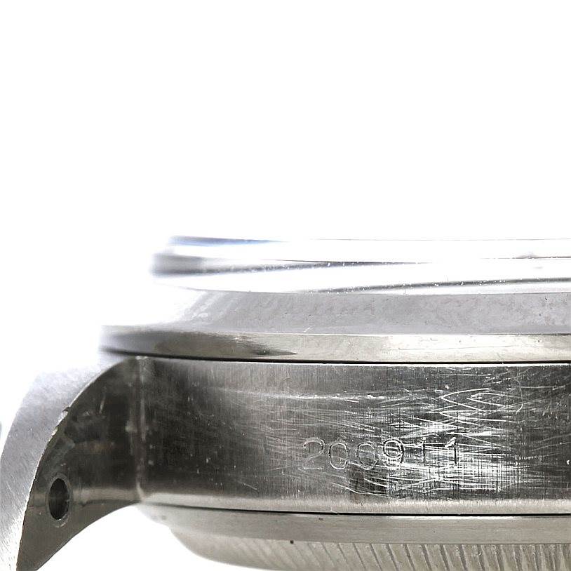 This image shows a close-up side view of the case of a Rolex Vintage Collection 6610 Men's Stainless Steel Black Dial 6610 Men's Stainless Steel Black Dial watch, highlighting the engraved serial number.