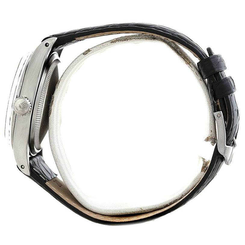 This side view shows the case, crown, and black leather strap of the Vintage Collection model by Rolex.