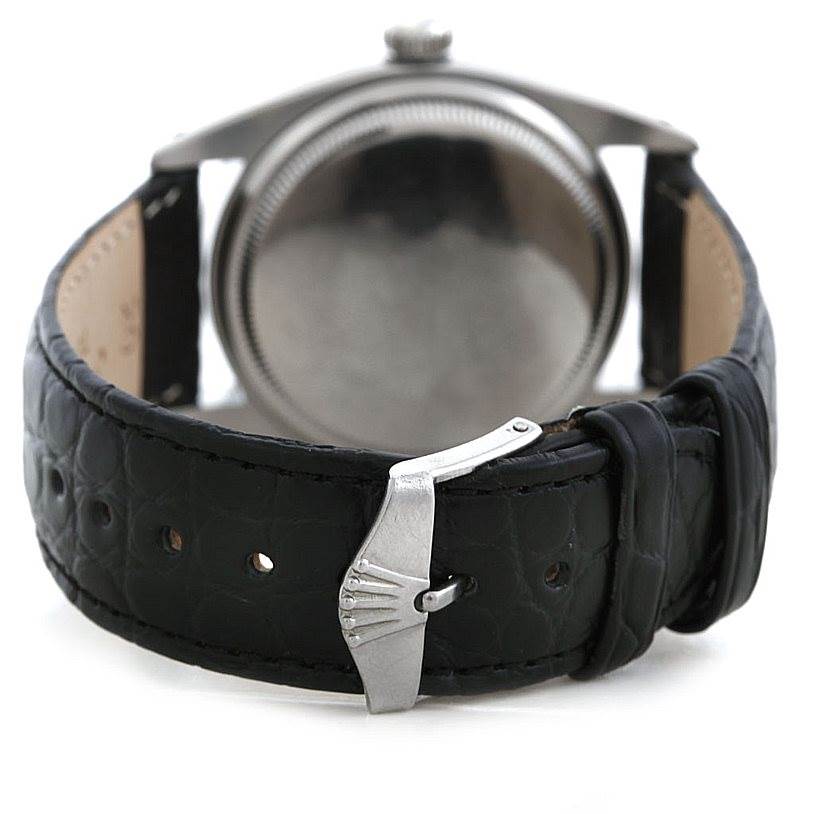 This image shows the back and clasp of a Rolex Vintage Collection 6610 Men's Stainless Steel Black Dial 6610 Men's Stainless Steel Black Dial watch with a black leather strap.