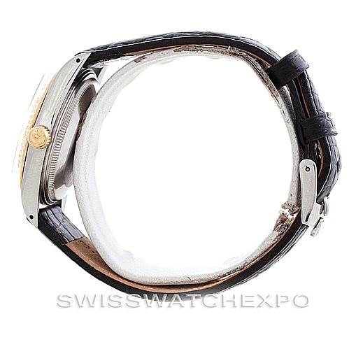 The image shows a side view of a Rolex Vintage Collection 5701 Men
s Stainless Steel Champagne Dial 5701 Men
s Stainless Steel Champagne Dial watch, highlighting the case, crown, and leather strap with a buckle clasp.