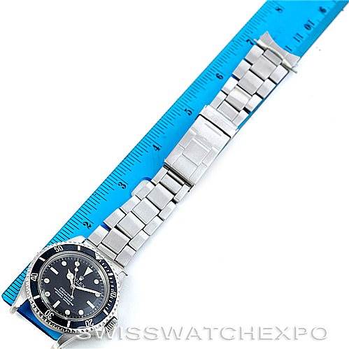 This image shows a Rolex Vintage Collection 5512 Men's Stainless Steel  5512 Men's Stainless Steel  watch laying flat with the bracelet fully extended next to a blue ruler.