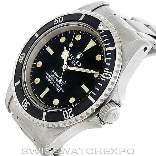 The image shows a close-up side angle of a Rolex Vintage Collection 5512 Men's Stainless Steel  5512 Men's Stainless Steel  watch, featuring its bezel, dial, crown, and part of the bracelet.