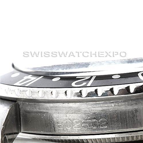 This image shows a side view of the bezel, part of the crown, and engraved serial number on the side of the Rolex Vintage Collection 1675 Men's Stainless Steel Black Dial 1675 Men's Stainless Steel Black Dial model.