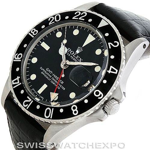 The image shows a Rolex Vintage Collection 1675 Men's Stainless Steel Black Dial 1675 Men's Stainless Steel Black Dial GMT-Master II watch at an oblique angle highlighting the dial, bezel, crown, and black leather strap.