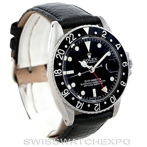 The Rolex Vintage Collection 1675 Men's Stainless Steel Black Dial 1675 Men's Stainless Steel Black Dial GMT-Master watch is shown at an angle highlighting the dial, bezel, and leather strap.