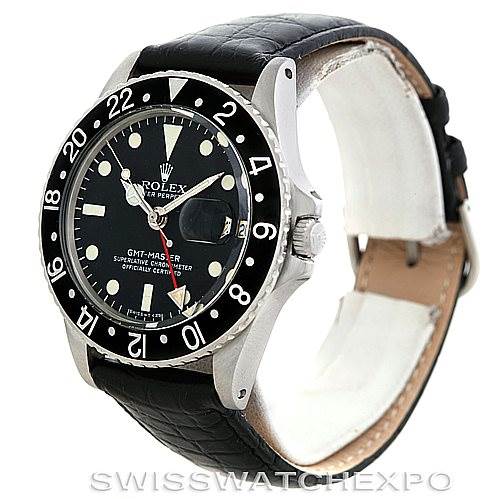 This image shows a Rolex Vintage Collection 1675 Men's Stainless Steel Black Dial 1675 Men's Stainless Steel Black Dial GMT-Master watch at a slight angle, highlighting the bezel, dial, and leather strap.