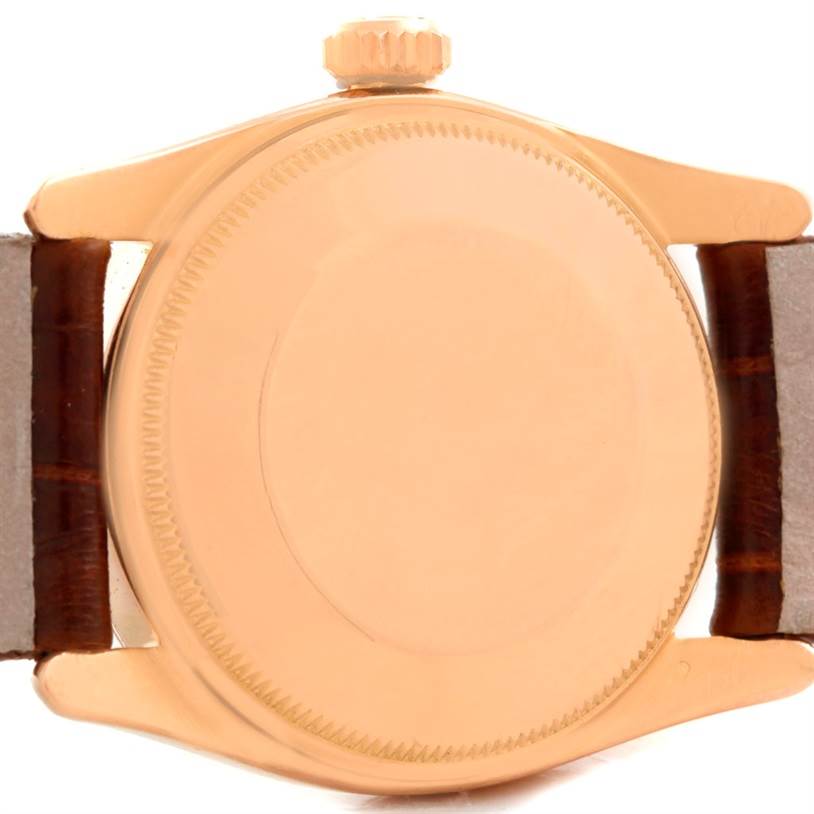 This image shows the case back and crown of the Rolex Vintage Collection 6090 Men's Rose Gold Silver Dial 6090 Men's Rose Gold Silver Dial model, viewed from the rear.