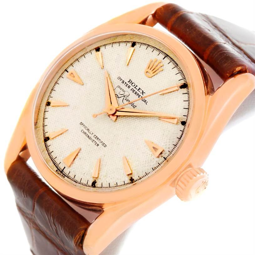 The image shows a close-up angle of a Rolex Vintage Collection 6090 Men's Rose Gold Silver Dial 6090 Men's Rose Gold Silver Dial model watch, highlighting the face, bezel, crown, and leather strap.