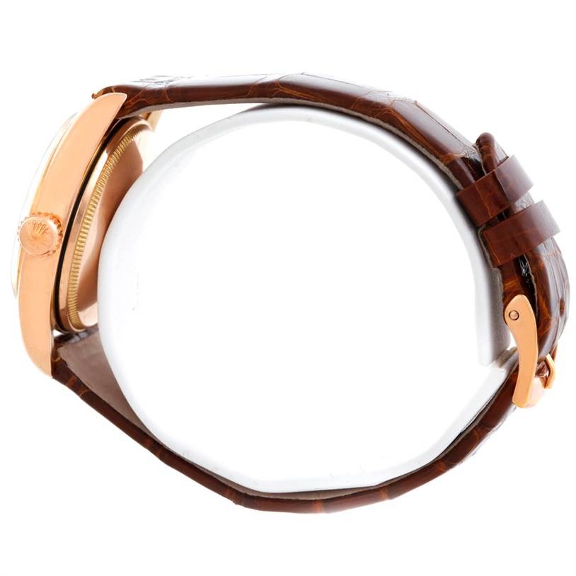 This image shows a side view of a Vintage Collection Rolex watch, highlighting the crown and brown leather strap.