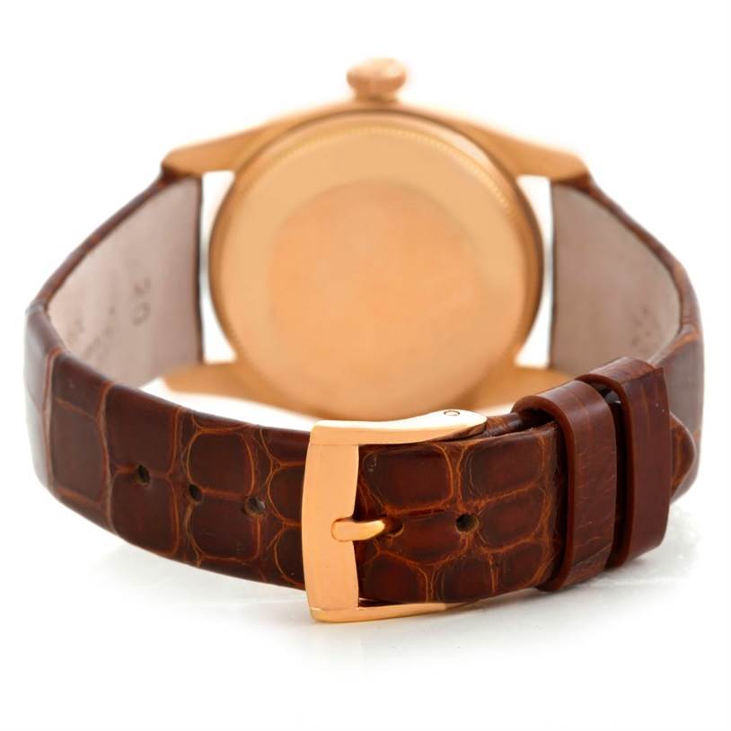 This image shows the back view of a Rolex Vintage Collection 6090 Men's Rose Gold Silver Dial 6090 Men's Rose Gold Silver Dial watch, highlighting the case and brown leather strap with a gold buckle.