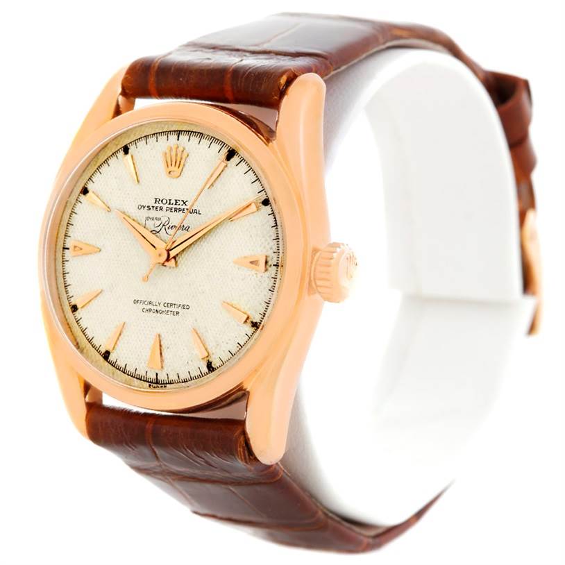 The image shows a side and front angle of the Rolex Vintage Collection 6090 Men's Rose Gold Silver Dial 6090 Men's Rose Gold Silver Dial Oyster Perpetual watch with a brown leather strap.