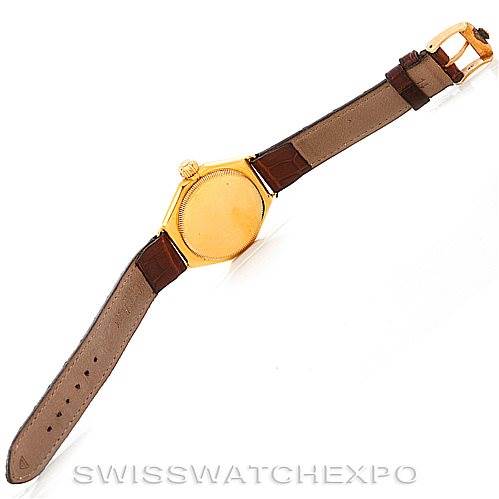 This Rolex Vintage Collection 679 Men's Yellow Gold Silver Dial 679 Men's Yellow Gold Silver Dial model is shown from the back, displaying the case back, crown, and leather strap with buckle.