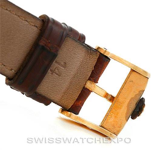 This image shows a close-up of the clasp and a portion of the leather strap of a Rolex Vintage Collection 679 Men's Yellow Gold Silver Dial 679 Men's Yellow Gold Silver Dial model watch.