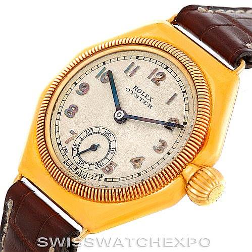 The image shows a Rolex Vintage Collection 679 Men's Yellow Gold Silver Dial 679 Men's Yellow Gold Silver Dial watch at an oblique angle, highlighting the dial, crown, and leather strap.