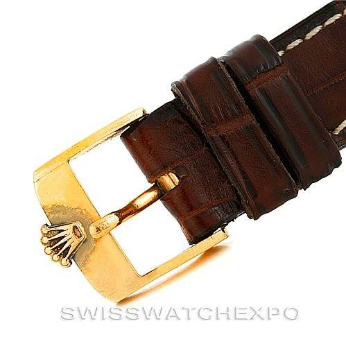 The image shows a close-up side angle of a brown leather strap with a gold buckle for the Rolex Vintage Collection 679 Men's Yellow Gold Silver Dial 679 Men's Yellow Gold Silver Dial watch.