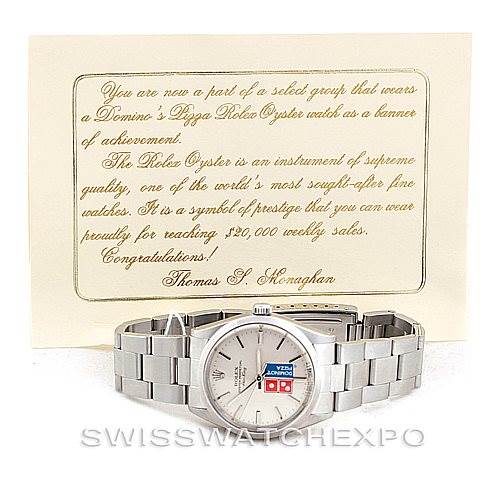 The image shows a front view of a Rolex Vintage Collection 5500 Men's Stainless Steel Silver Dial 5500 Men's Stainless Steel Silver Dial watch with a written card behind it.