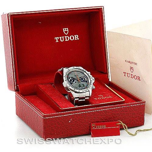 The image shows a Rolex Vintage Collection 7159 Men's Stainless Steel Grey Dial 7159 Men's Stainless Steel Grey Dial watch displayed in an open Tudor red box with its bracelet and dial visible.