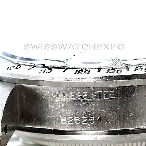 The image shows a close-up of the side of a Rolex Vintage Collection 7159 Men's Stainless Steel Grey Dial 7159 Men's Stainless Steel Grey Dial watch, highlighting its bezel, stainless steel case, and serial number.