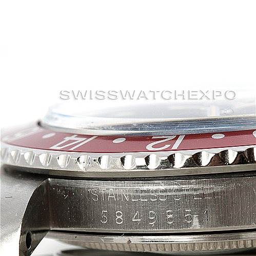 This image shows a close-up side view of a Rolex Vintage Collection 1675 Men's Stainless Steel Black Dial 1675 Men's Stainless Steel Black Dial watch, focusing on the bezel, case, and serial engraving.