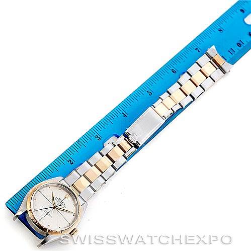 This image shows the Rolex Vintage Collection 6582 Men's Steel and Gold (two tone) Silver Dial 6582 Men's Steel and Gold (two tone) Silver Dial watch laid flat next to a ruler, displaying the face, bracelet, and clasp.