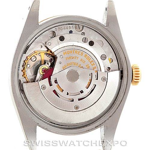 This image shows the movement of a Rolex Vintage Collection 1500 Men's Steel and Gold (two tone) Blue Dial 1500 Men's Steel and Gold (two tone) Blue Dial watch from a rear view, exposing its internal mechanism and components.