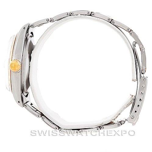 This side view of the Rolex Vintage Collection 1500 Men's Steel and Gold (two tone) Blue Dial 1500 Men's Steel and Gold (two tone) Blue Dial watch displays its metal case, crown, and bracelet.