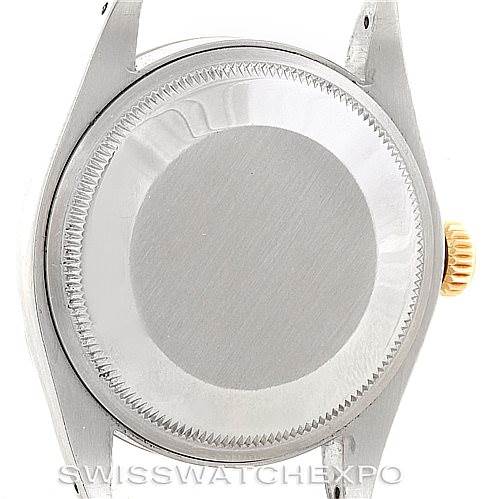 The image shows the back case and crown of a Vintage Collection model by Rolex, viewed from the back.