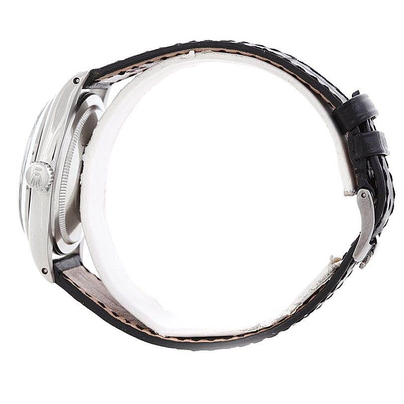 The image shows a side view of a Rolex Vintage Collection 1016 Men's Stainless Steel Black Dial 1016 Men's Stainless Steel Black Dial model, highlighting the case, crown, and leather strap.