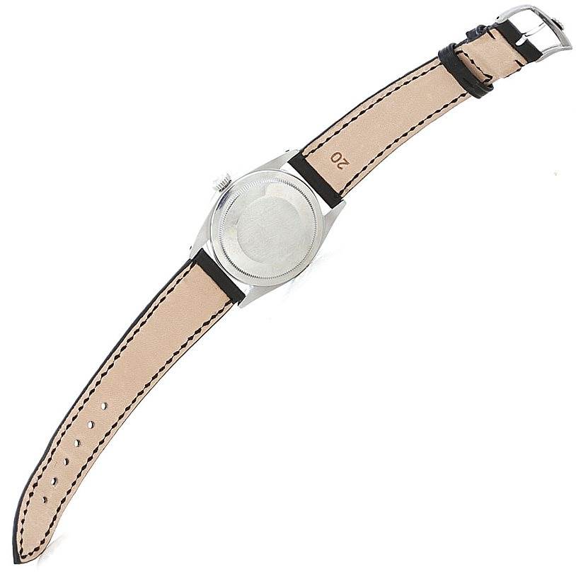 The image shows the back view of the Rolex Vintage Collection 1016 Men's Stainless Steel Black Dial 1016 Men's Stainless Steel Black Dial watch, displaying its case back and leather strap.