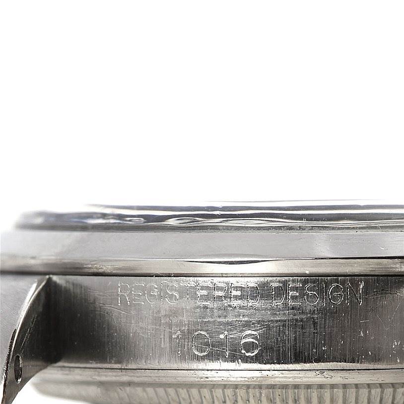 This image shows a close-up side view of the casing of a Rolex Vintage Collection 1016 Men's Stainless Steel Black Dial 1016 Men's Stainless Steel Black Dial model, highlighting the engraved design number 1016.