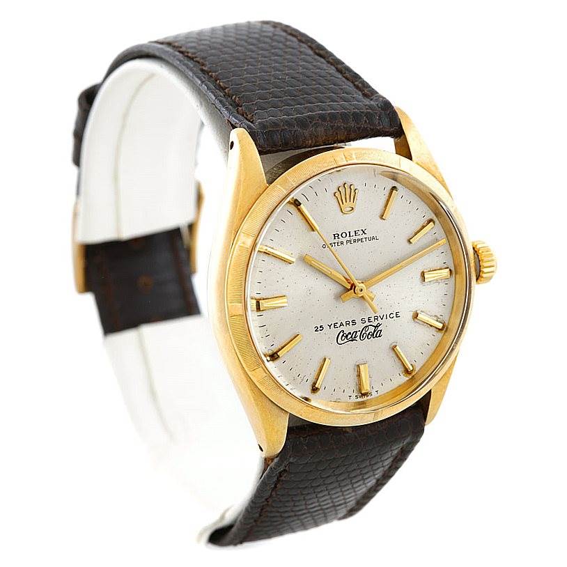 The image shows a Rolex Vintage Collection 1003 Yellow Gold Silver Dial 1003 Yellow Gold Silver Dial model watch at a three-quarter angle, highlighting the dial, bezel, and leather strap.